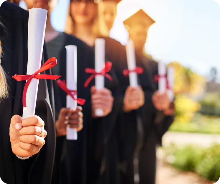 Graduates holding diplomas